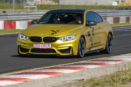 Driving behind the wheel of a BMW M4 around the track (4 laps)